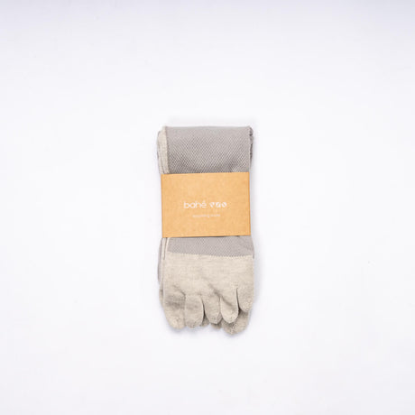 Pair of Bahe Flow Grounding five-toe socks folded with branded packaging.
