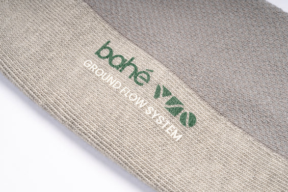 Close-up detail of Bahe Flow Standard Grounding sock fabric and logo.