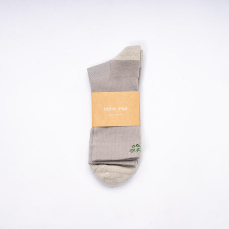 Pair of Bahe Flow Standard Grounding socks folded with branded packaging.