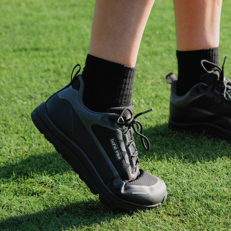 Black barefoot shoe on grass