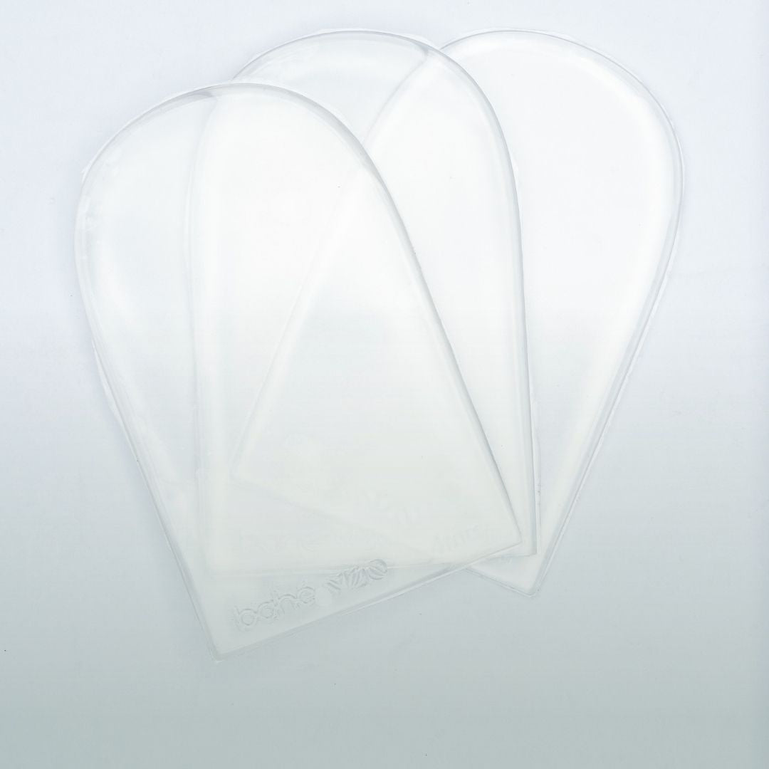 Three clear heel lifts on a light gray background