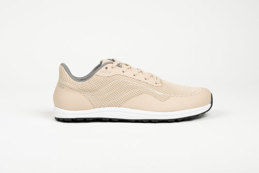 Profile view of Bahé Revive barefoot style grounding shoe in Sandstone (beige)