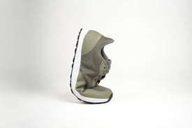Bahé Revive barefoot style shoe in Forest (green) being flexed to highlight the flexibility of the shoe construction