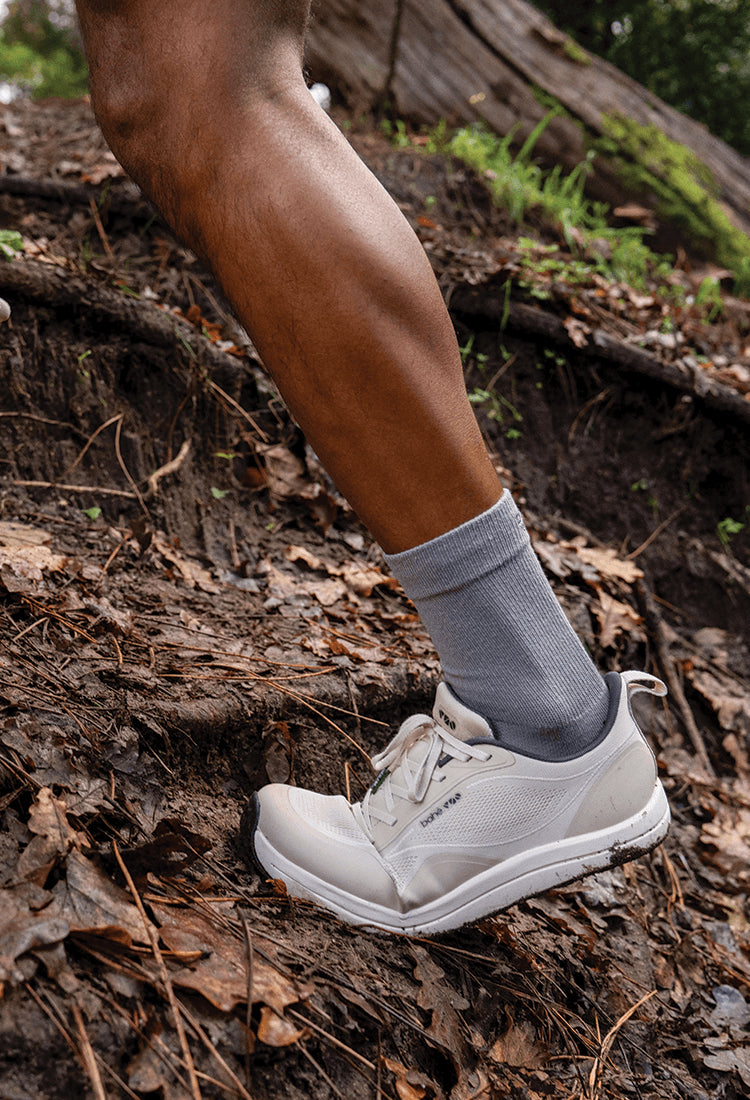 Person running up hill in Bahé shoes