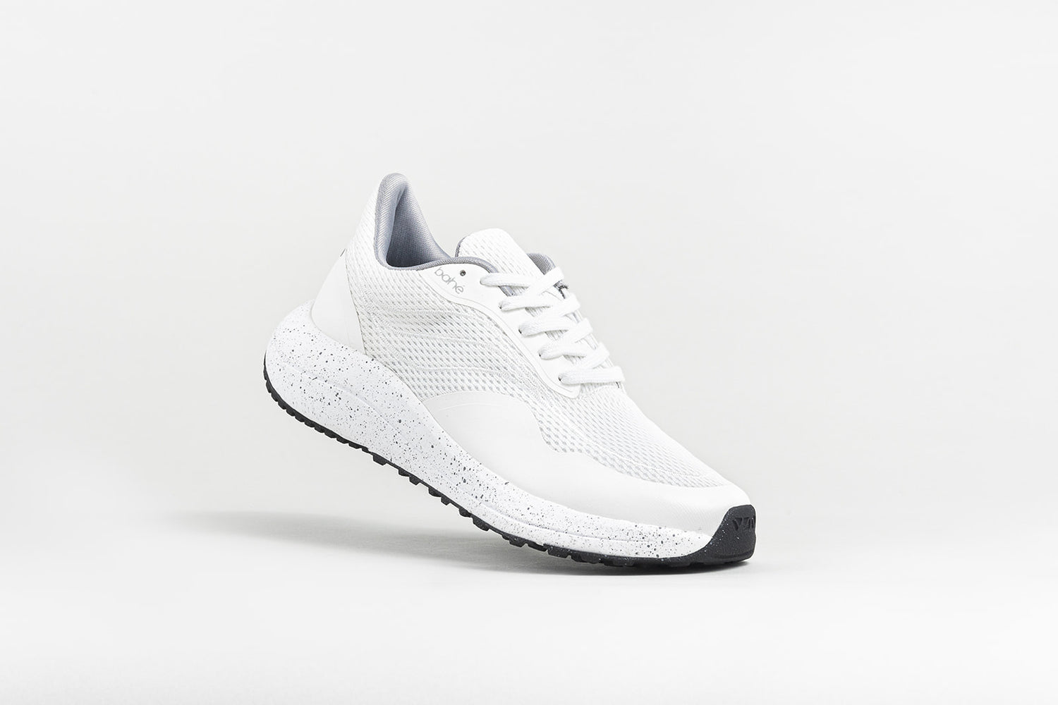 Dynamic/angled view of Bahé Recharge grounding shoes in Frost (white)