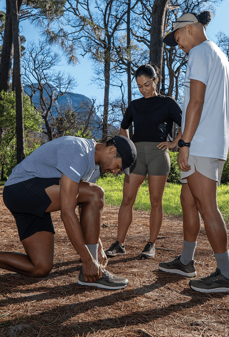 Three people in Bahé running shoes