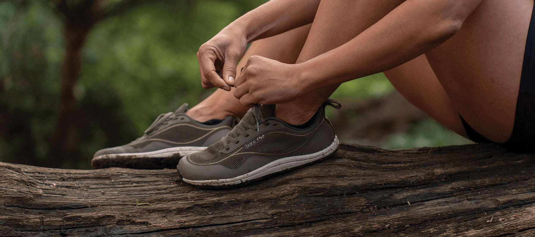Women lacing up shoes