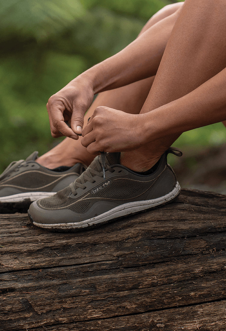 Women lacing up shoes