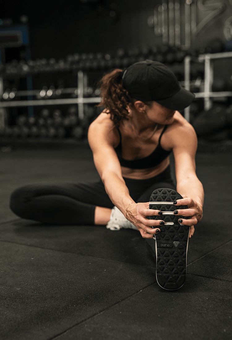 Woman stretching in barefoot shoes
