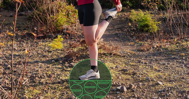 Person running on a trail with a focus on their grounding shoes