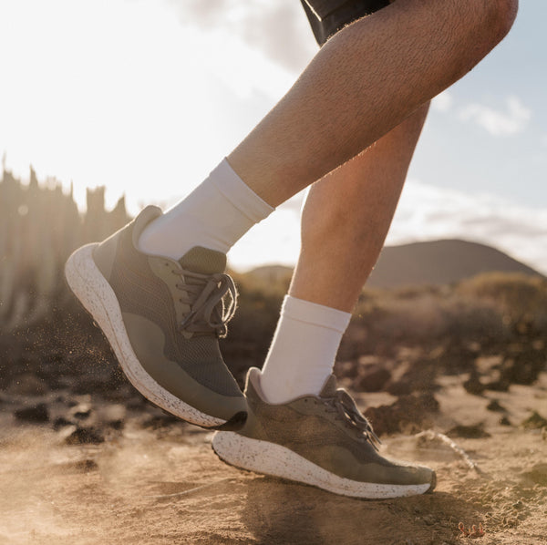 Man running in Bahé Recharge grounding shoes