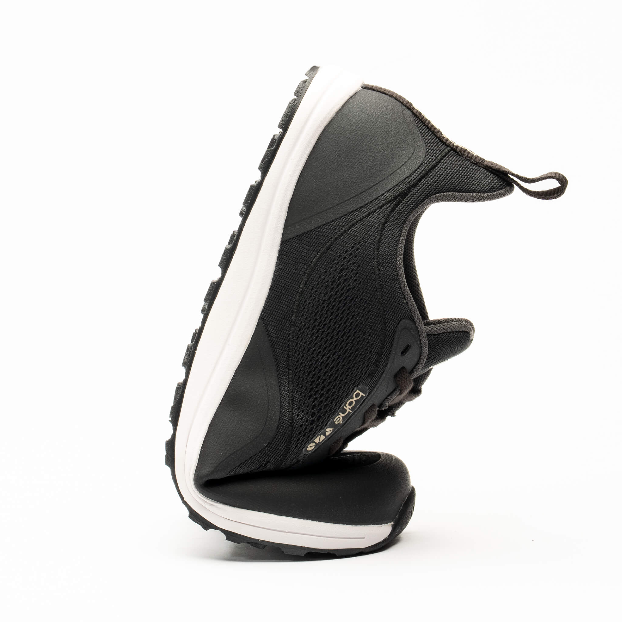 Black sneaker with white sole on a white background