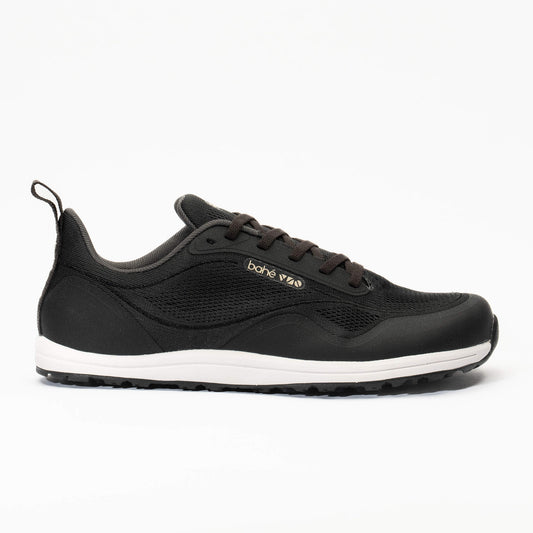 Black sneaker with white sole on a white background