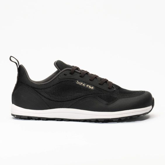 Black sneaker with white sole on a white background