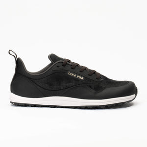 Black sneaker with white sole on a white background