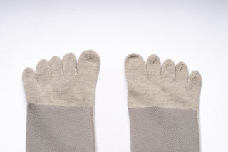 Feet of Bahe Flow Grounding five-toe socks, top view.