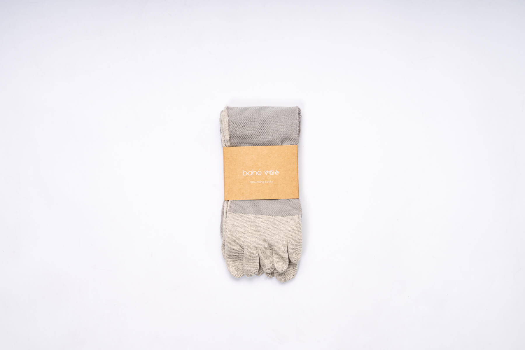 Pair of Bahe Flow Grounding five-toe socks folded with branded packaging.