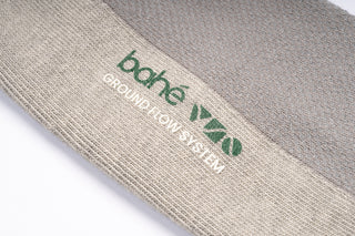 Close-up detail of Bahe Flow Standard Grounding sock fabric and logo.