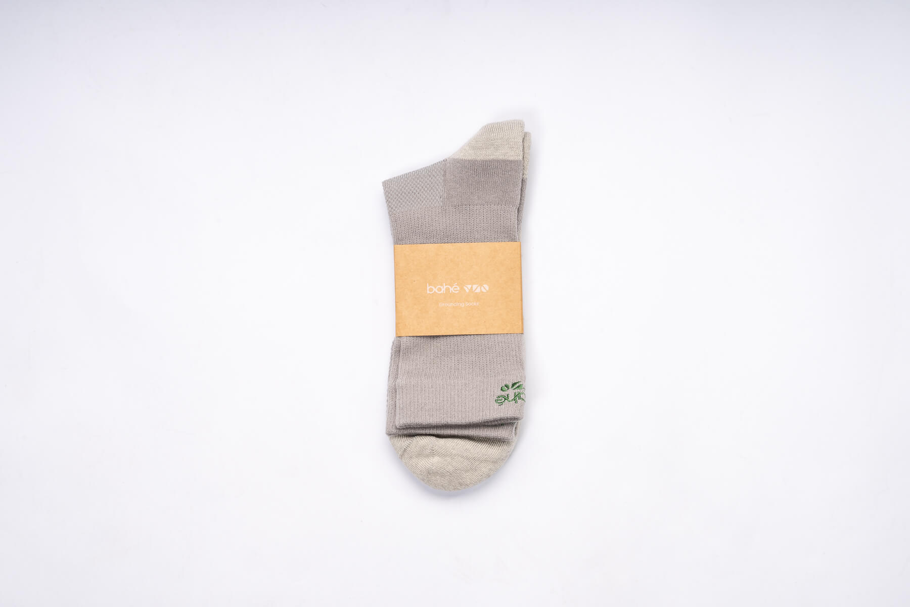 Pair of Bahe Flow Standard Grounding socks folded with branded packaging.