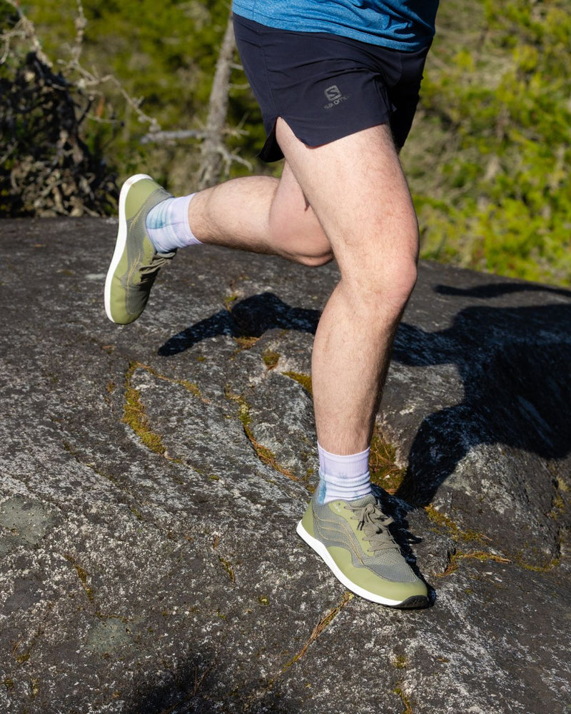 Person running on a rocky trail 